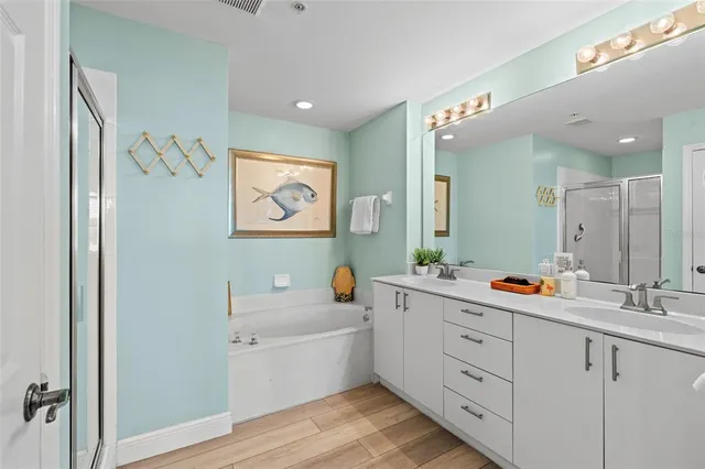 a bathroom with a glass shower door