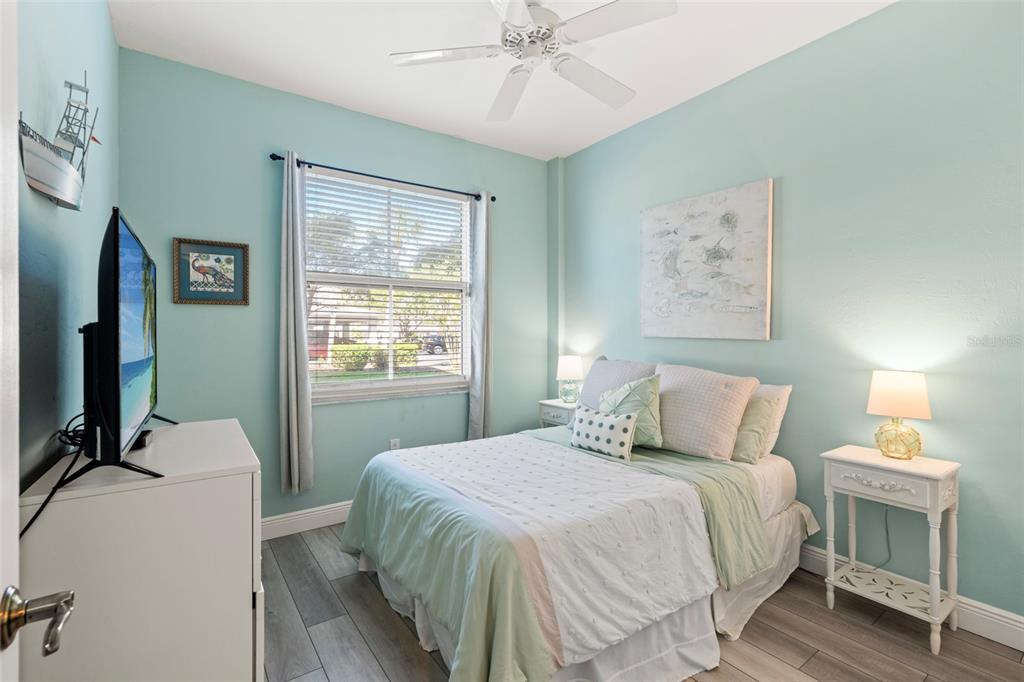2060 Matecumbe Key Road, Unit 2106 Punta Gorda, FL 33955 - Photo 25 of 56 a bedroom with a bed and a chandelier