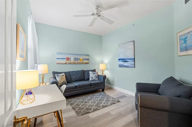 a living room with furniture and a window
