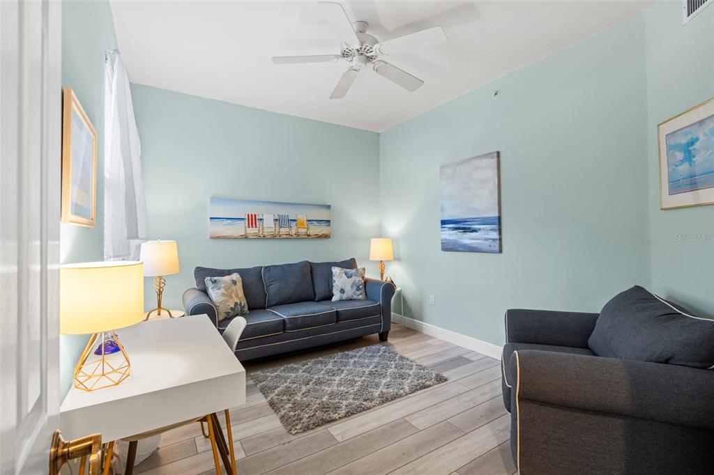 2060 Matecumbe Key Road, Unit 2106 Punta Gorda, FL 33955 - Photo 27 of 56 a living room with a couch and a window