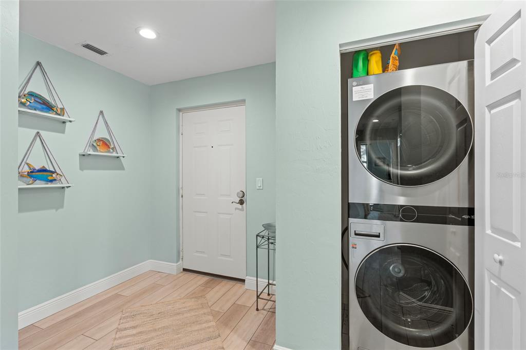 2060 Matecumbe Key Road, Unit 2106 Punta Gorda, FL 33955 - Photo 32 of 56 a view of a hallway with washer and dryer