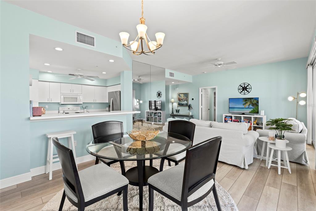 2060 Matecumbe Key Road, Unit 2106 Punta Gorda, FL 33955 - Photo 10 of 56 a view of a dining room with furniture and wooden floor