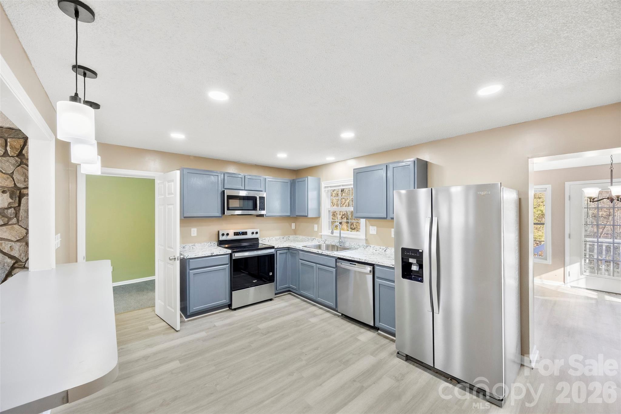 161 Potato House Road Lawndale, NC 28090 - Photo 6 of 33 a kitchen with stainless steel appliances granite countertop a refrigerator and a stove top oven