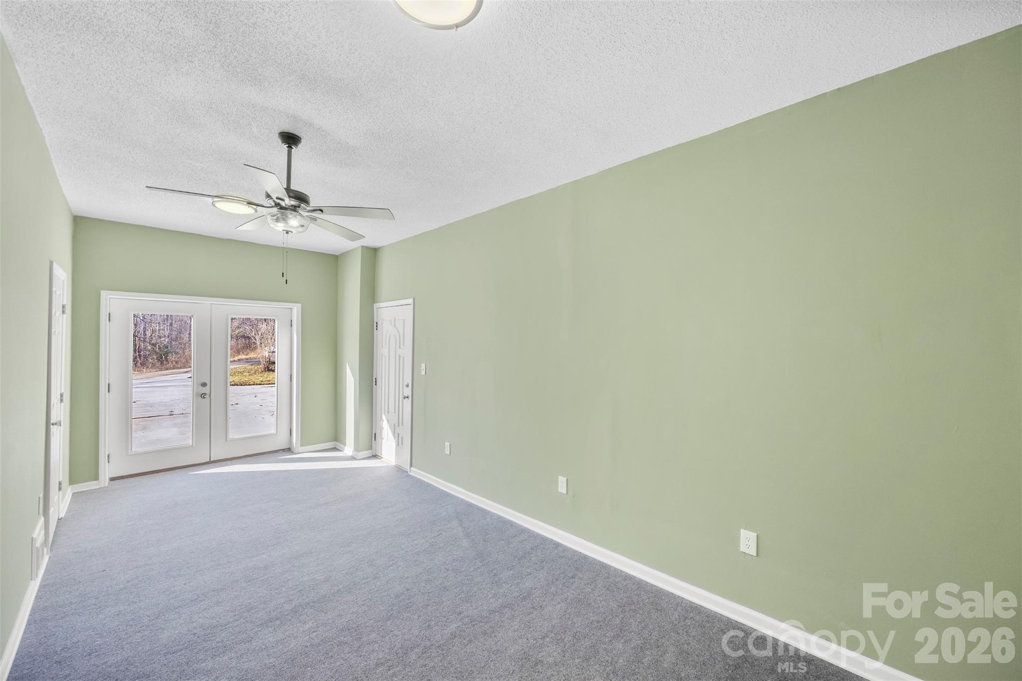 161 Potato House Road Lawndale, NC 28090 - Photo 10 of 33 a view of a room with a ceiling fan and a window
