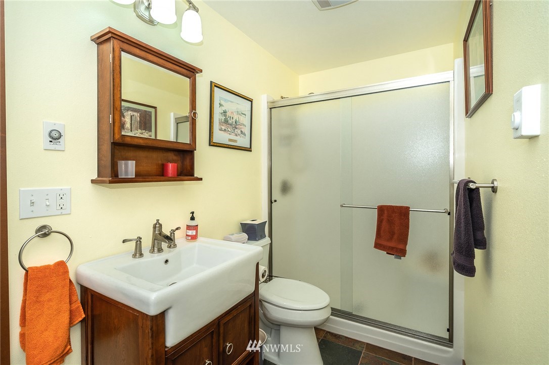 16847 Sheldon Lane Southwest Rochester, WA 98579 - Photo 20 of 40 a bathroom with a sink toilet and shower