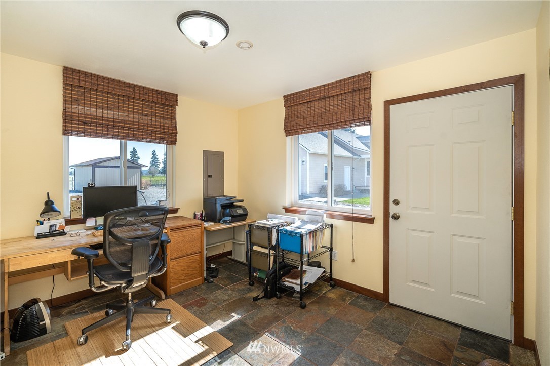 16847 Sheldon Lane Southwest Rochester, WA 98579 - Photo 21 of 40 a view of a workspace with furniture and a window