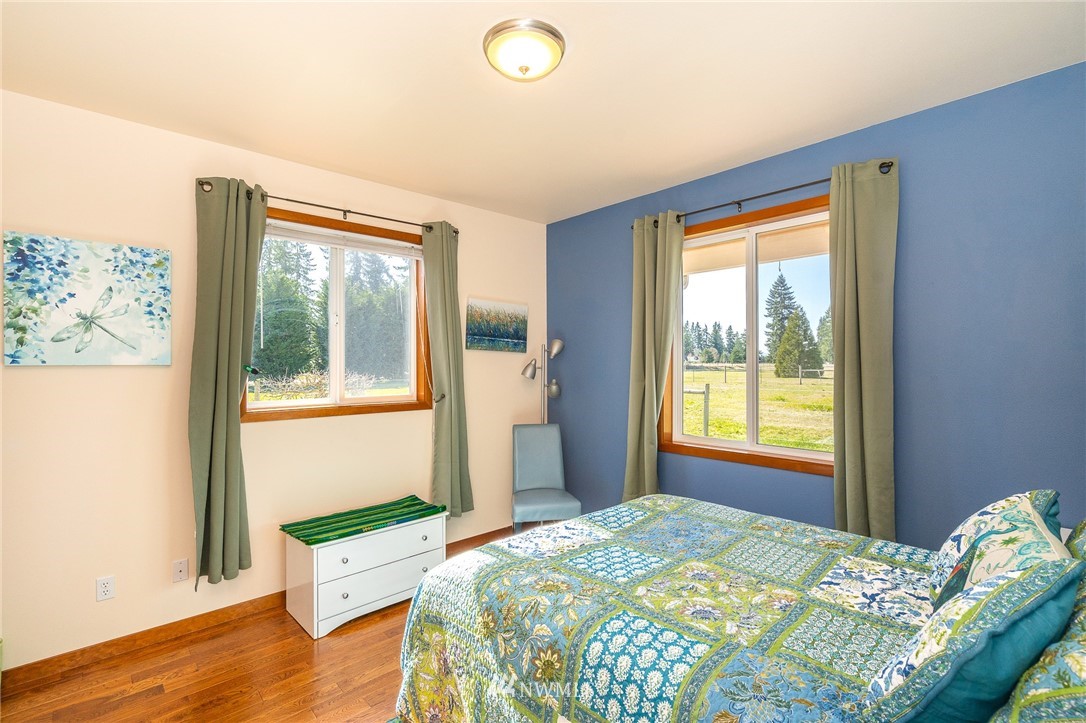 16847 Sheldon Lane Southwest Rochester, WA 98579 - Photo 32 of 40 a bedroom with a bed and a window