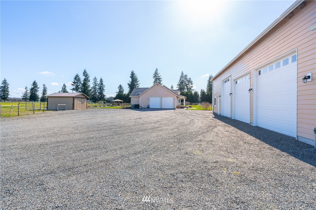 16847 Sheldon Lane Southwest Rochester, WA 98579 - Photo 37 of 40 a view of a house with a yard