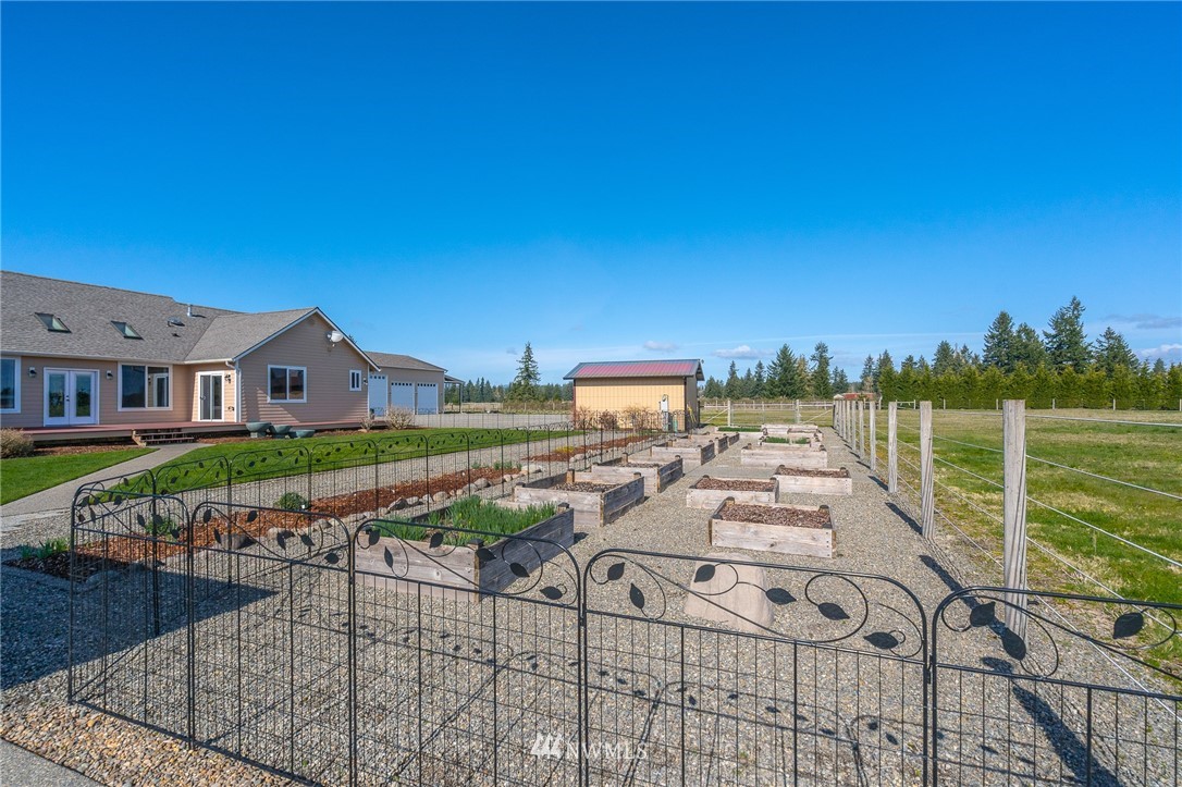 16847 Sheldon Lane Southwest Rochester, WA 98579 - Photo 6 of 40 a view of a house with backyard porch and sitting area