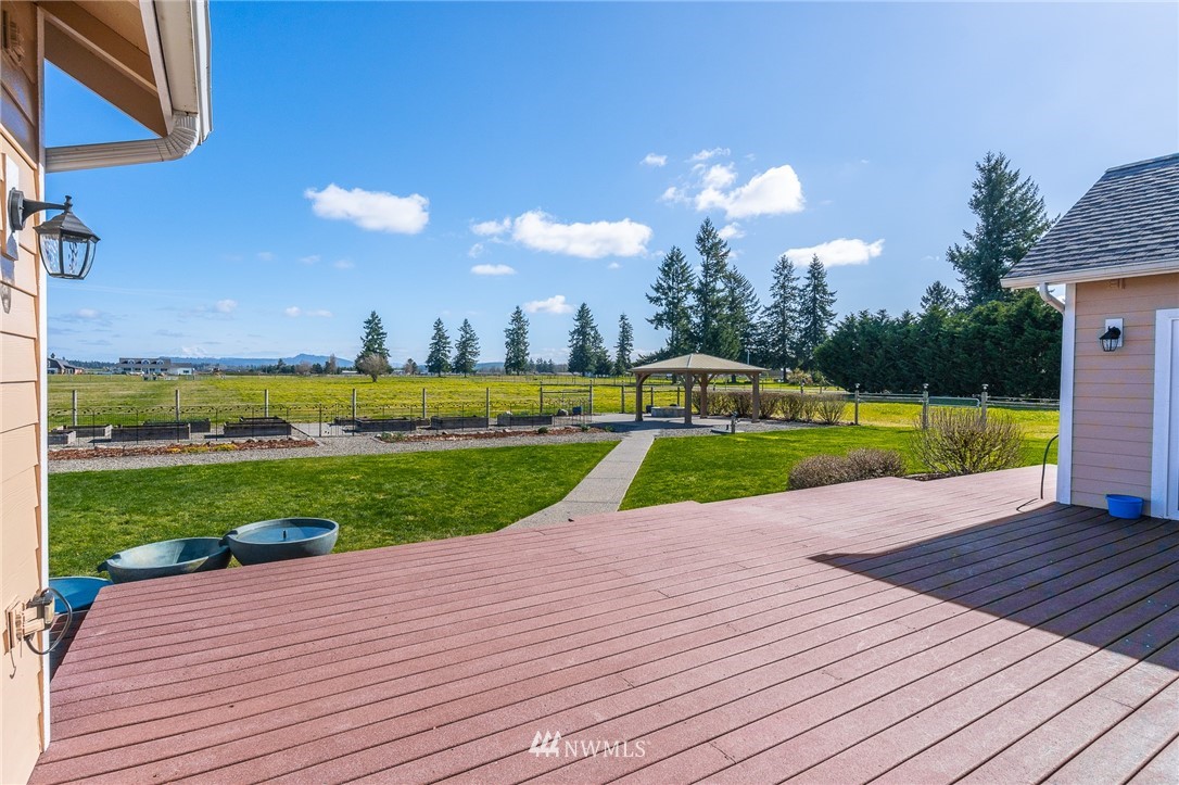 16847 Sheldon Lane Southwest Rochester, WA 98579 - Photo 9 of 40 a view of a house with a swimming pool and a yard