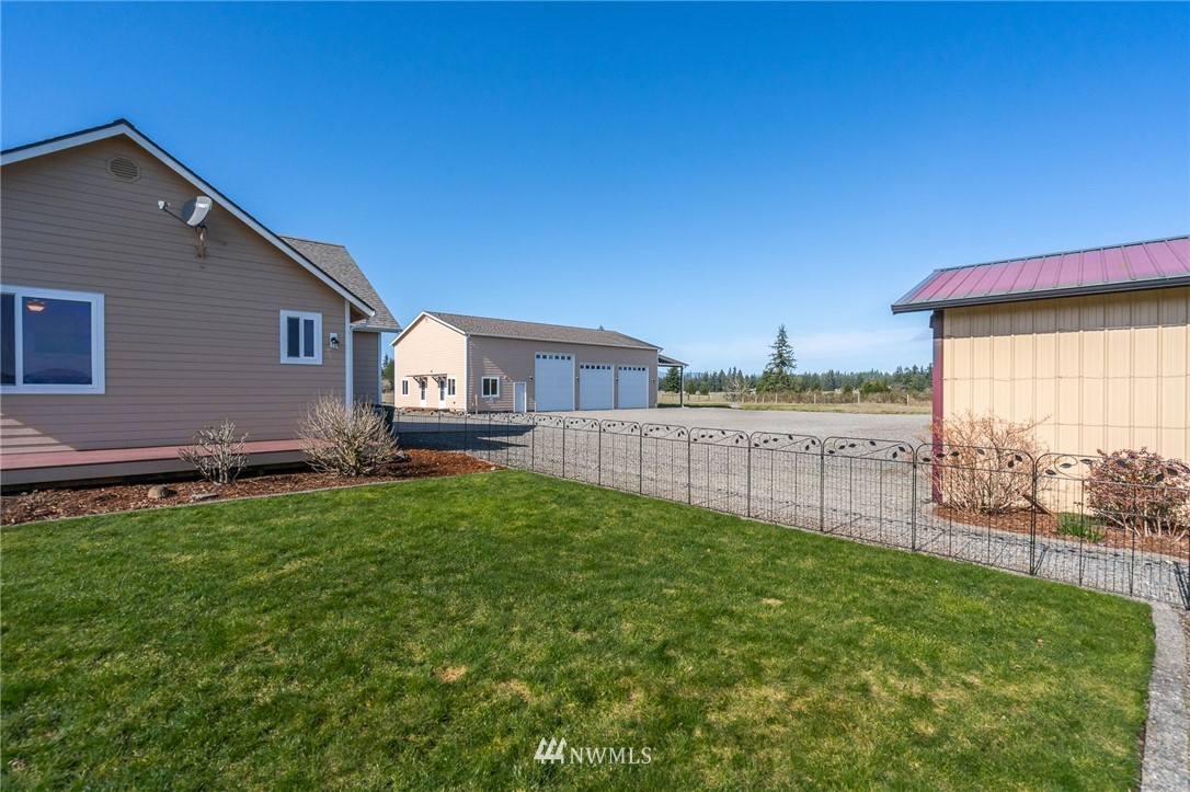 16847 Sheldon Lane Southwest Rochester, WA 98579 - Photo 10 of 40 a view of a house with backyard and a tree