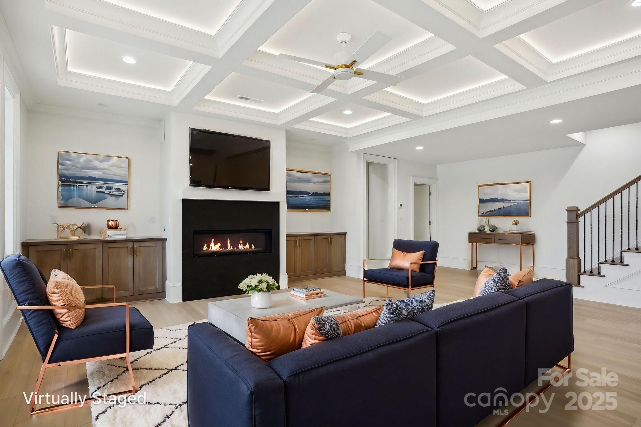 8813 Graham Road Denver, NC 28037 - Photo 11 of 35 a living room with furniture a flat screen tv and a fireplace