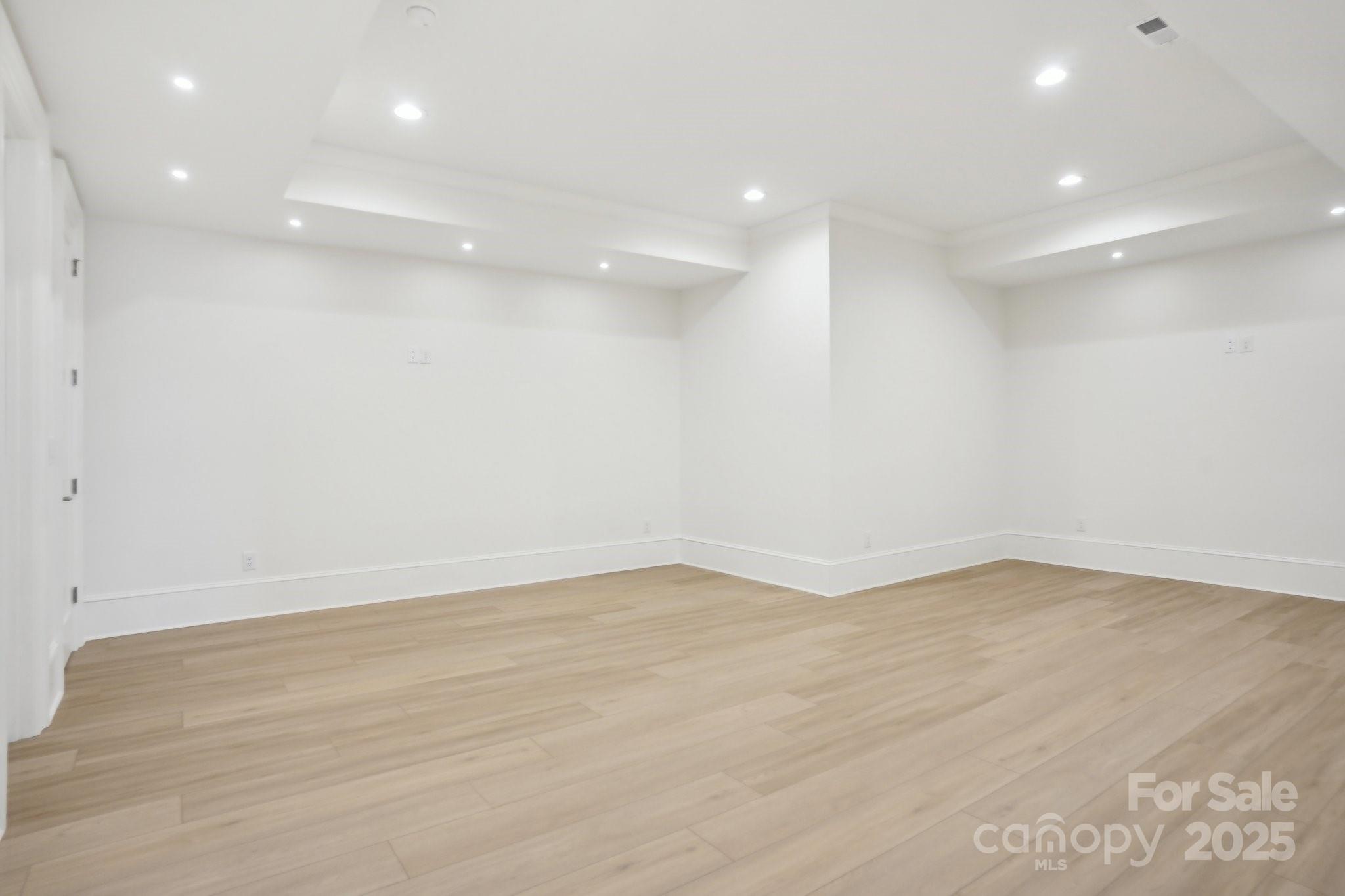 8813 Graham Road Denver, NC 28037 - Photo 14 of 35 an empty room with wooden floor and windows