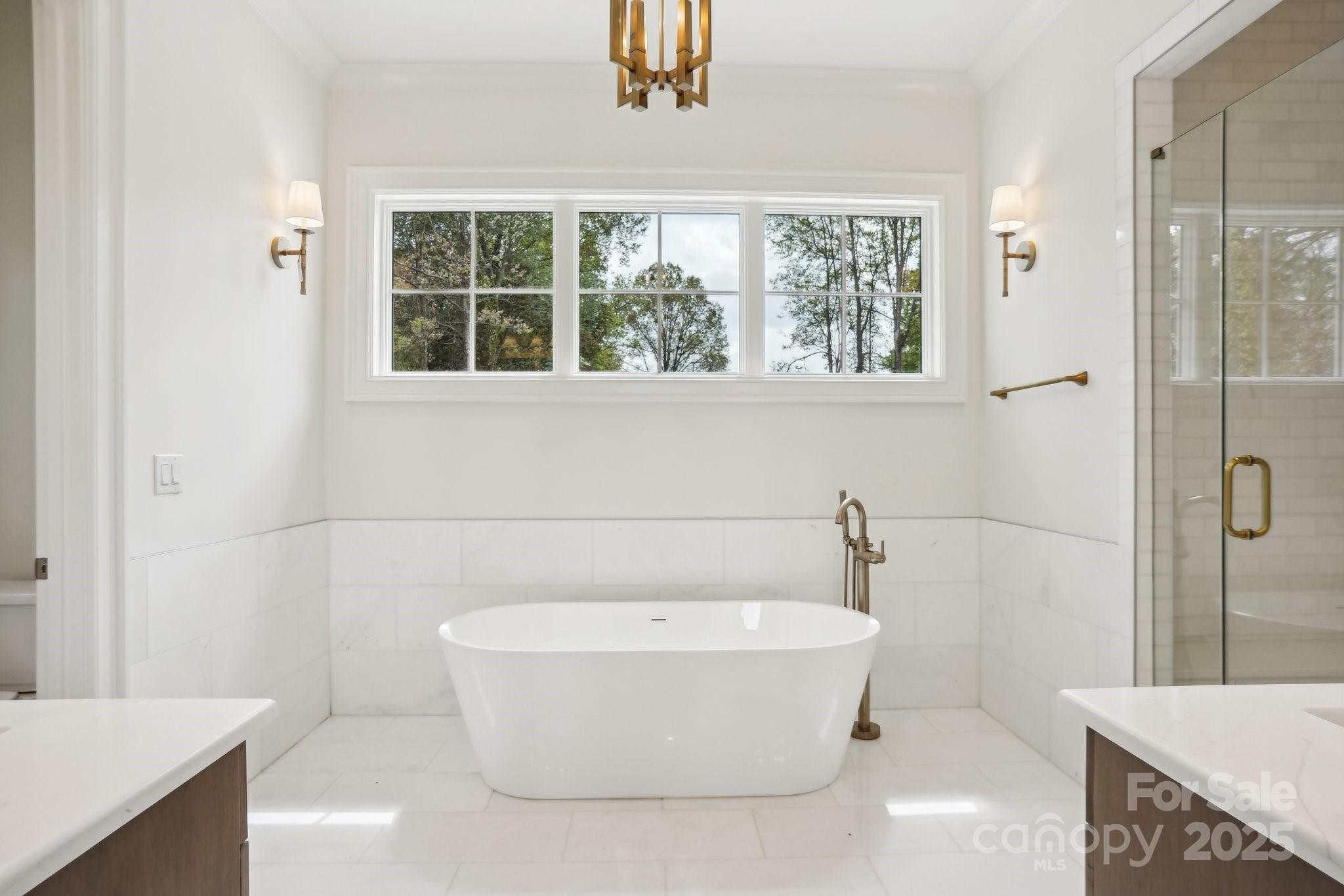 8813 Graham Road Denver, NC 28037 - Photo 25 of 35 a white bath tub sitting in a bathroom next to a window