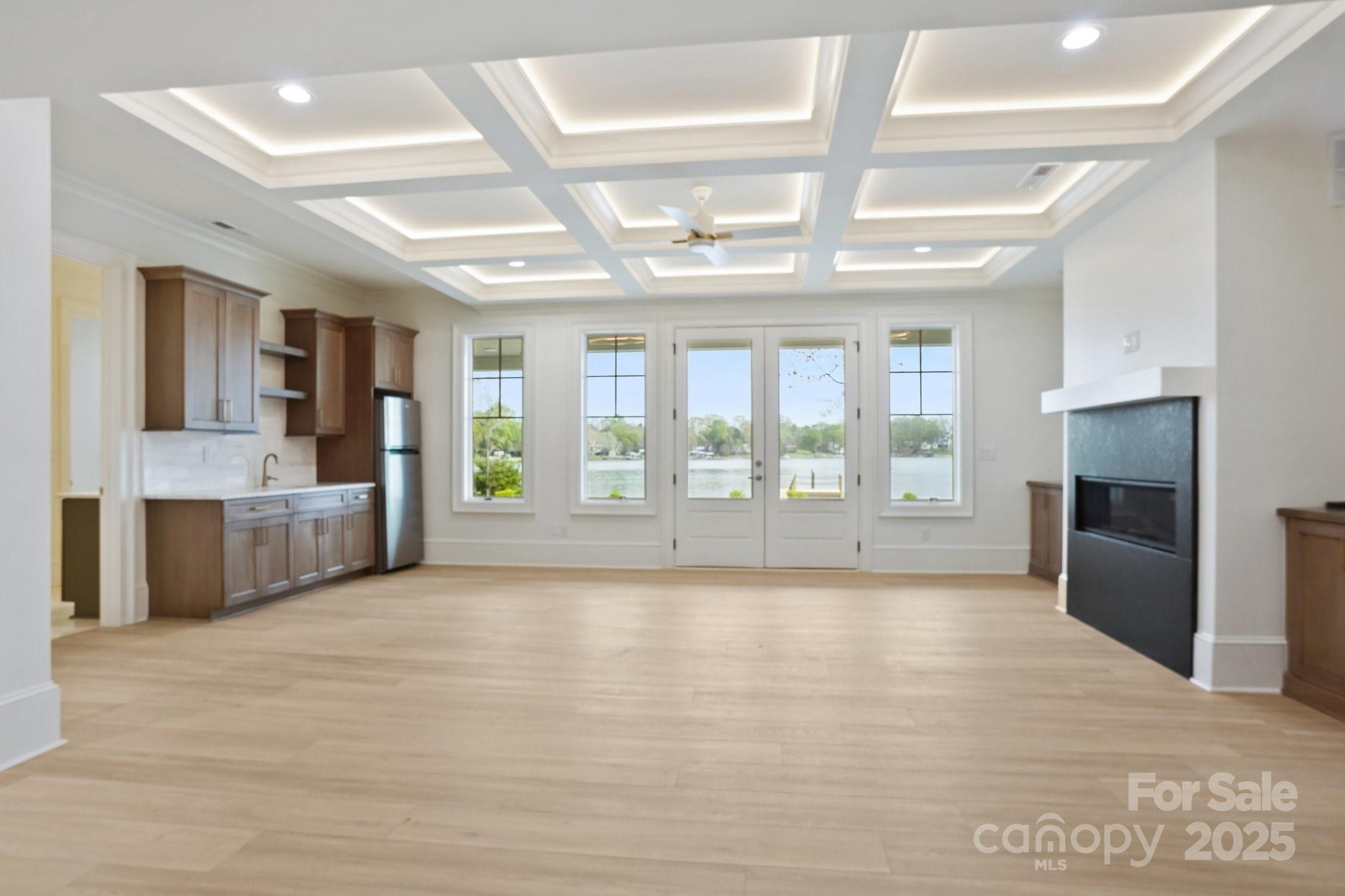 8813 Graham Road Denver, NC 28037 - Photo 29 of 35 a view of an empty room with a fireplace and a window