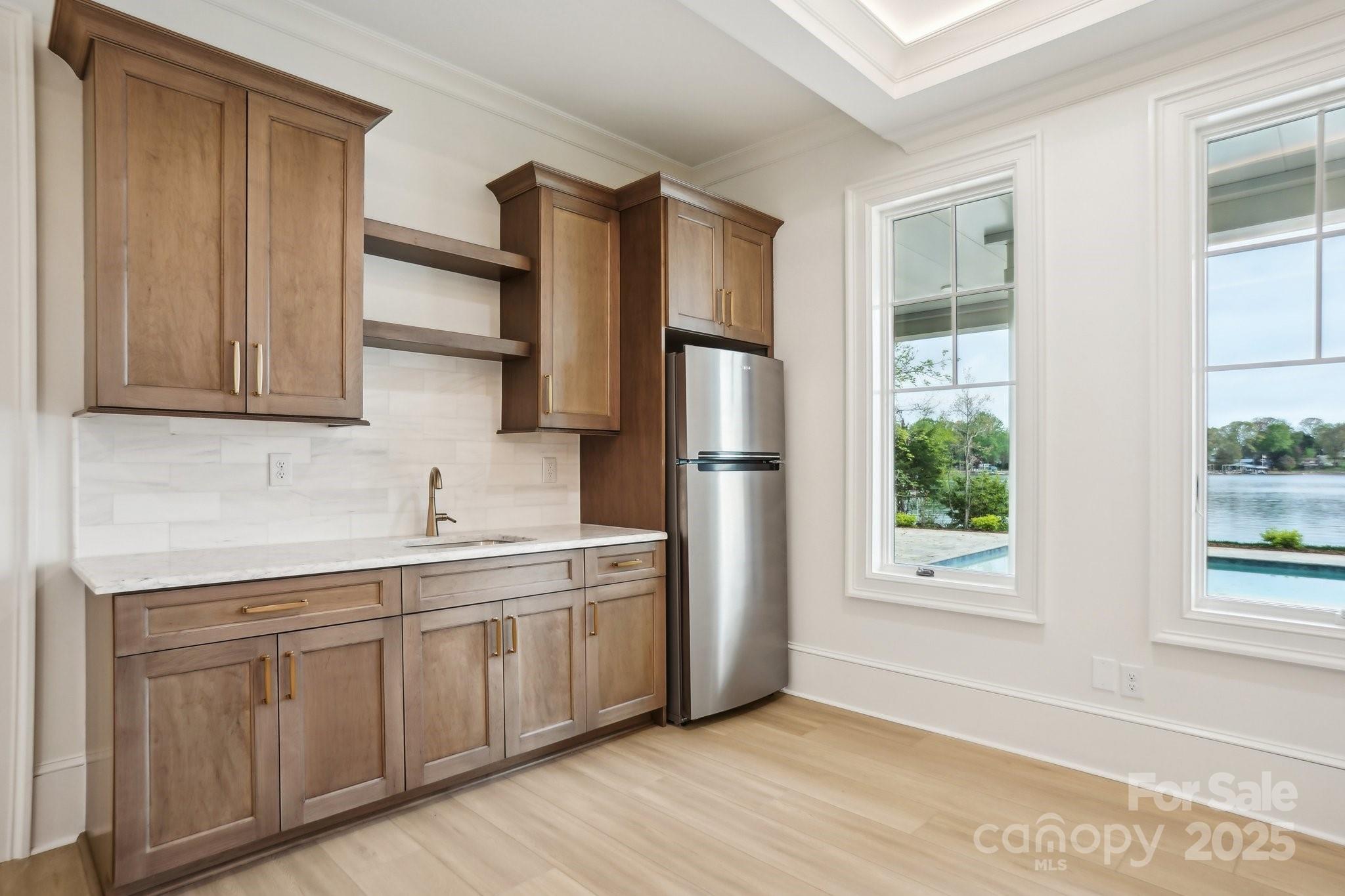 8813 Graham Road Denver, NC 28037 - Photo 30 of 35 a kitchen with stainless steel appliances granite countertop a refrigerator sink and cabinets