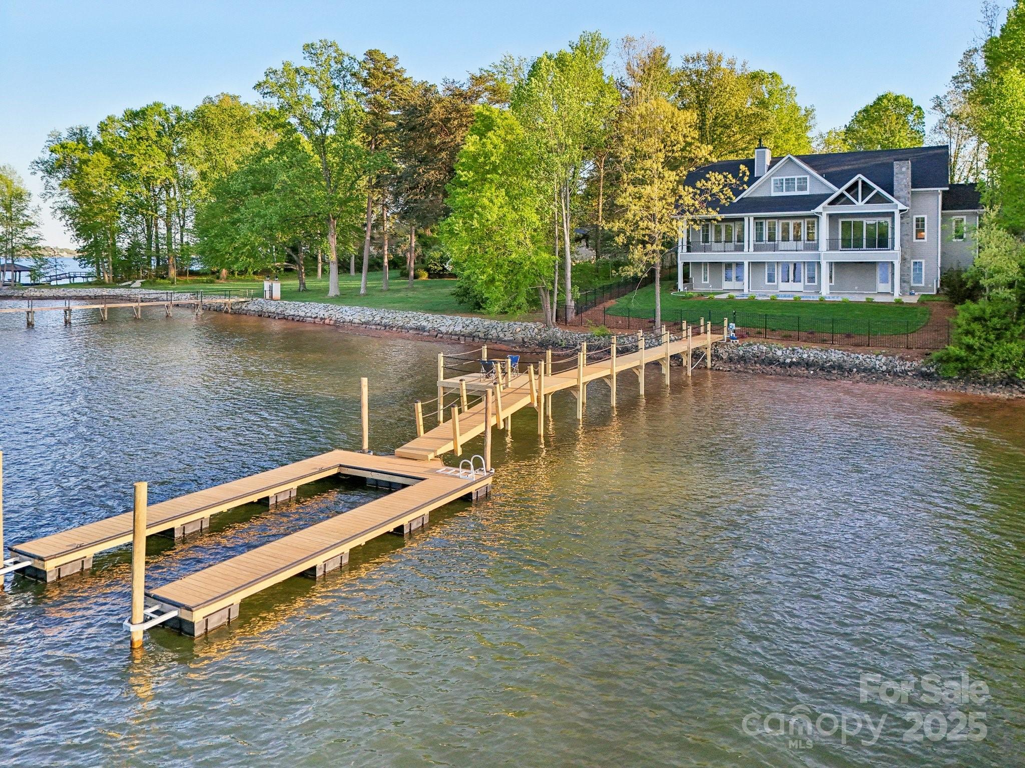 8813 Graham Road Denver, NC 28037 - Photo 3 of 35 a view of a lake with a house in the background