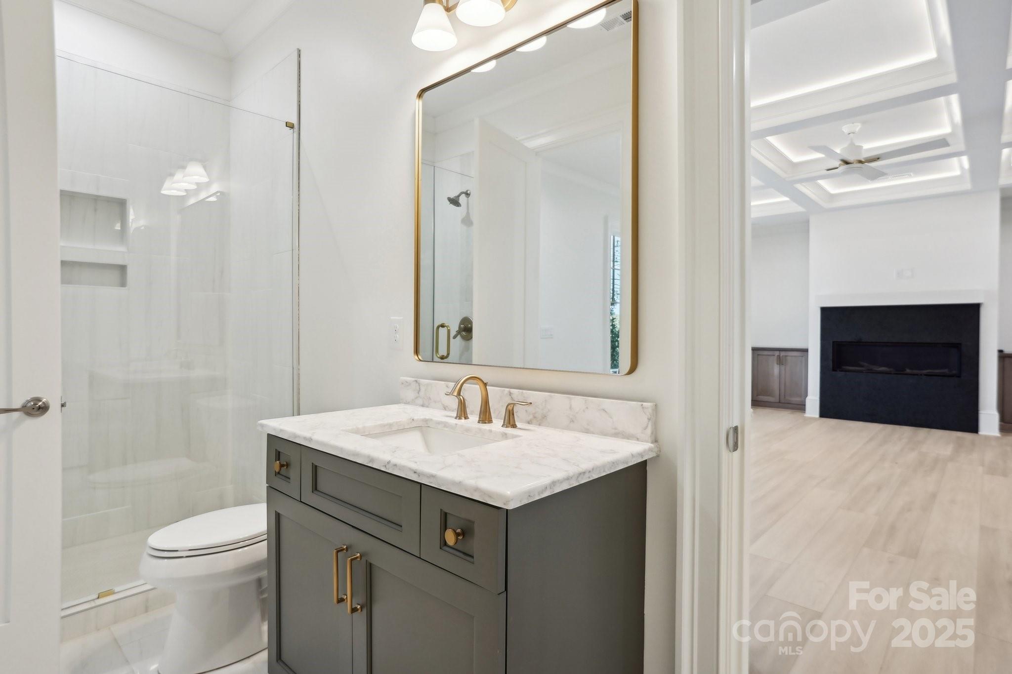 8813 Graham Road Denver, NC 28037 - Photo 33 of 35 a bathroom with a sink and a mirror