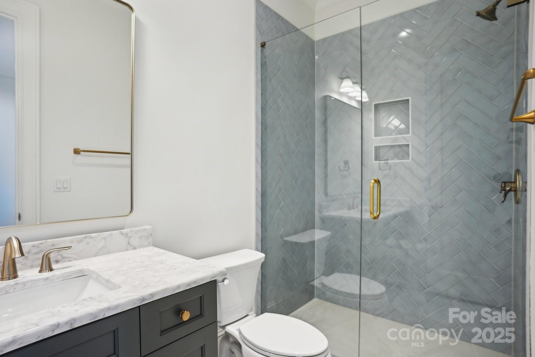 8813 Graham Road Denver, NC 28037 - Photo 35 of 35 a bathroom with a sink toilet and shower