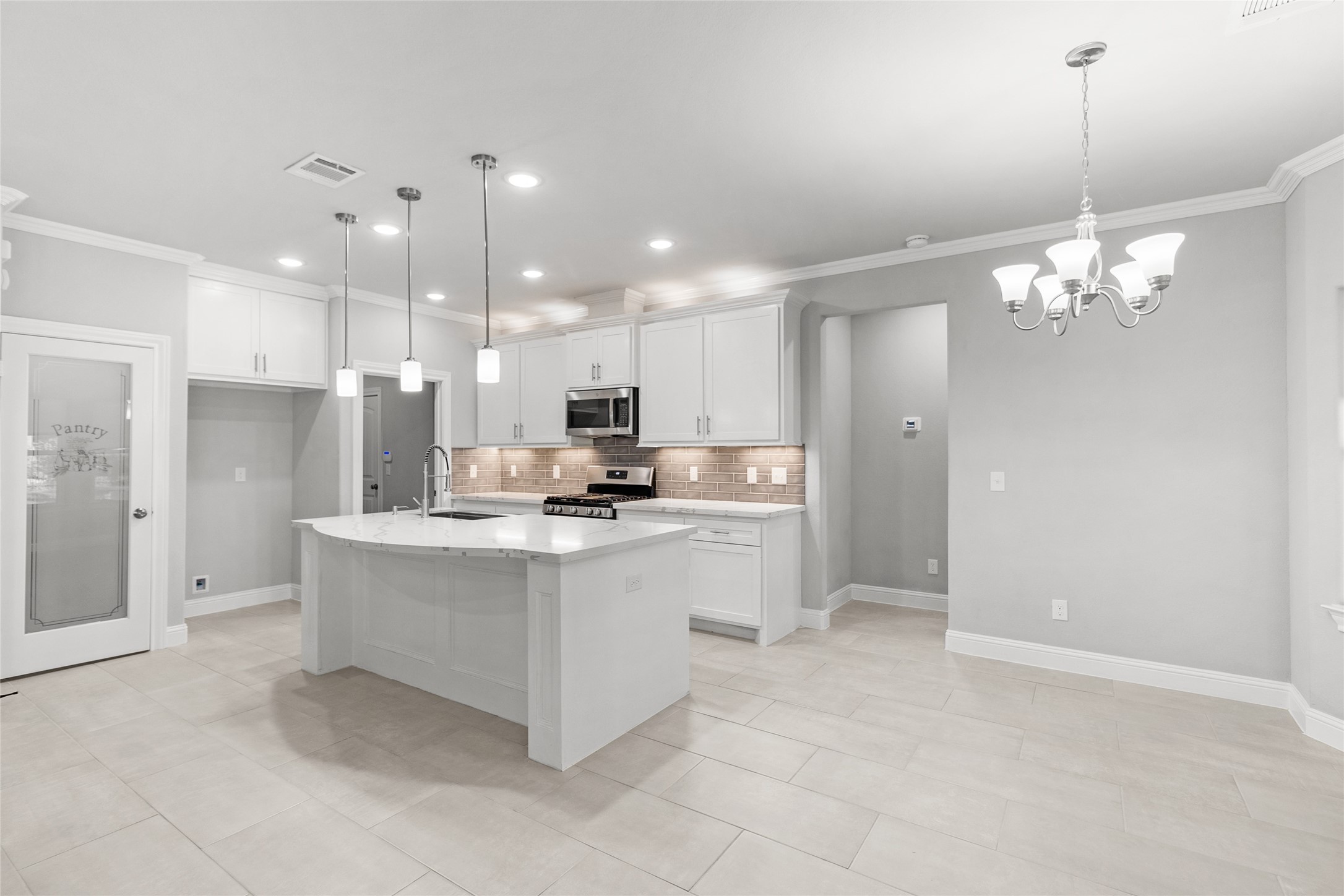 116 Augusta Drive Huntsville, TX 77340 - Photo 12 of 30 a large white kitchen with a refrigerator a sink and a stove