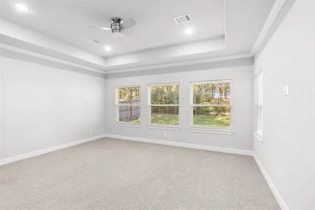 an empty room with a empty space and windows