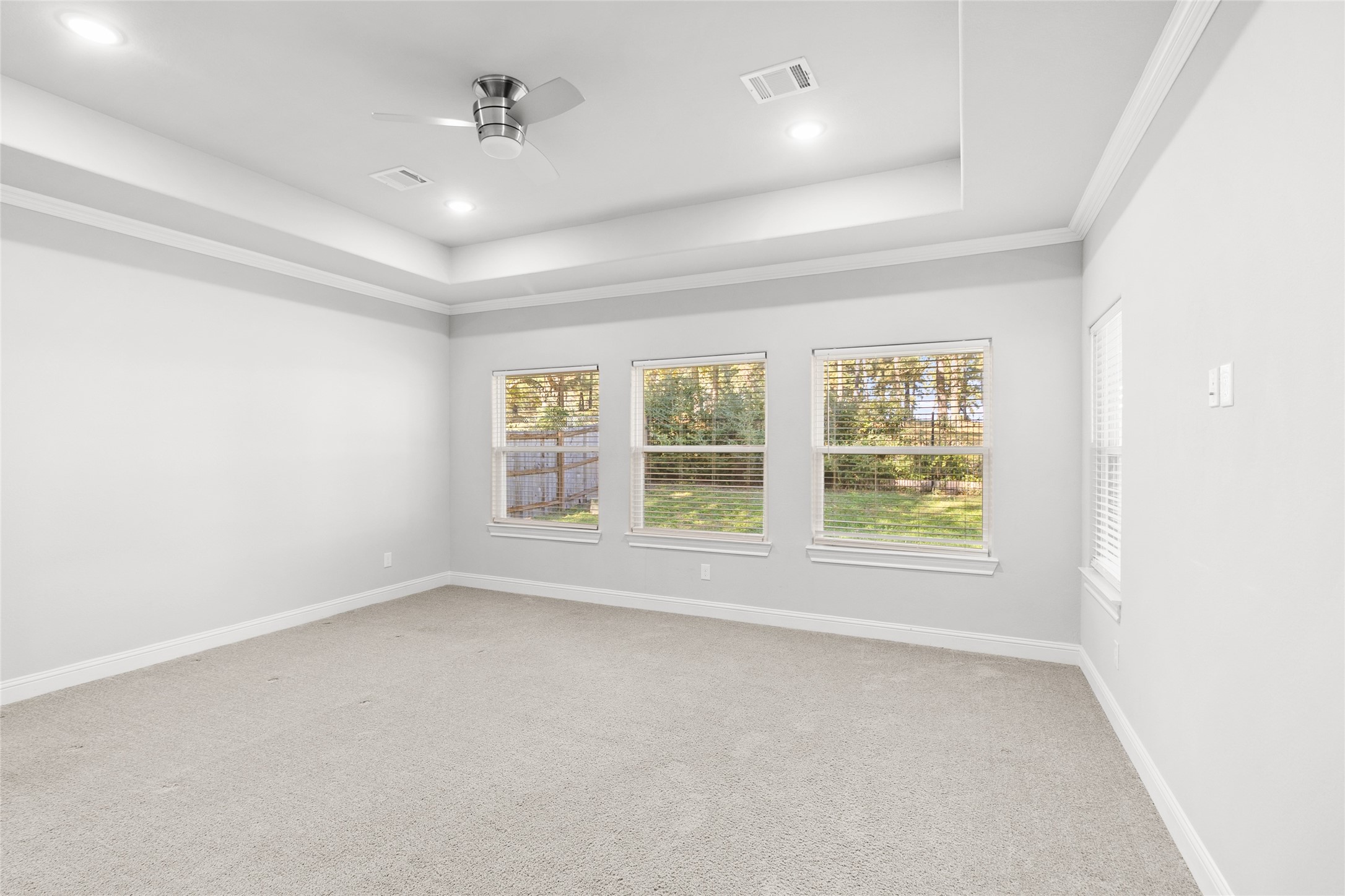 116 Augusta Drive Huntsville, TX 77340 - Photo 19 of 30 an empty room with a empty space and windows