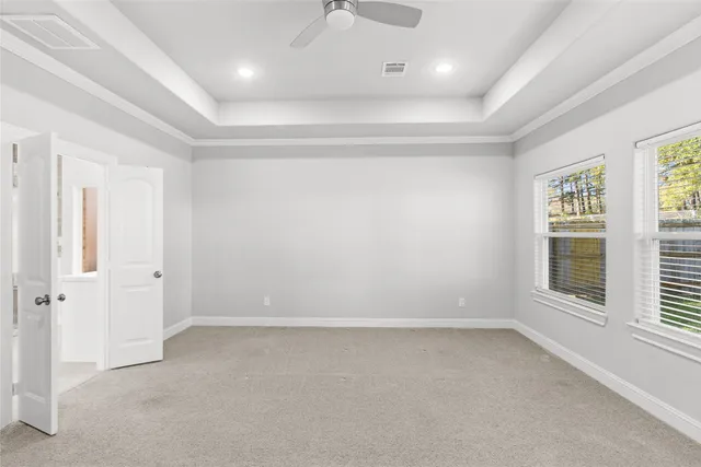 an empty room with a empty space and windows