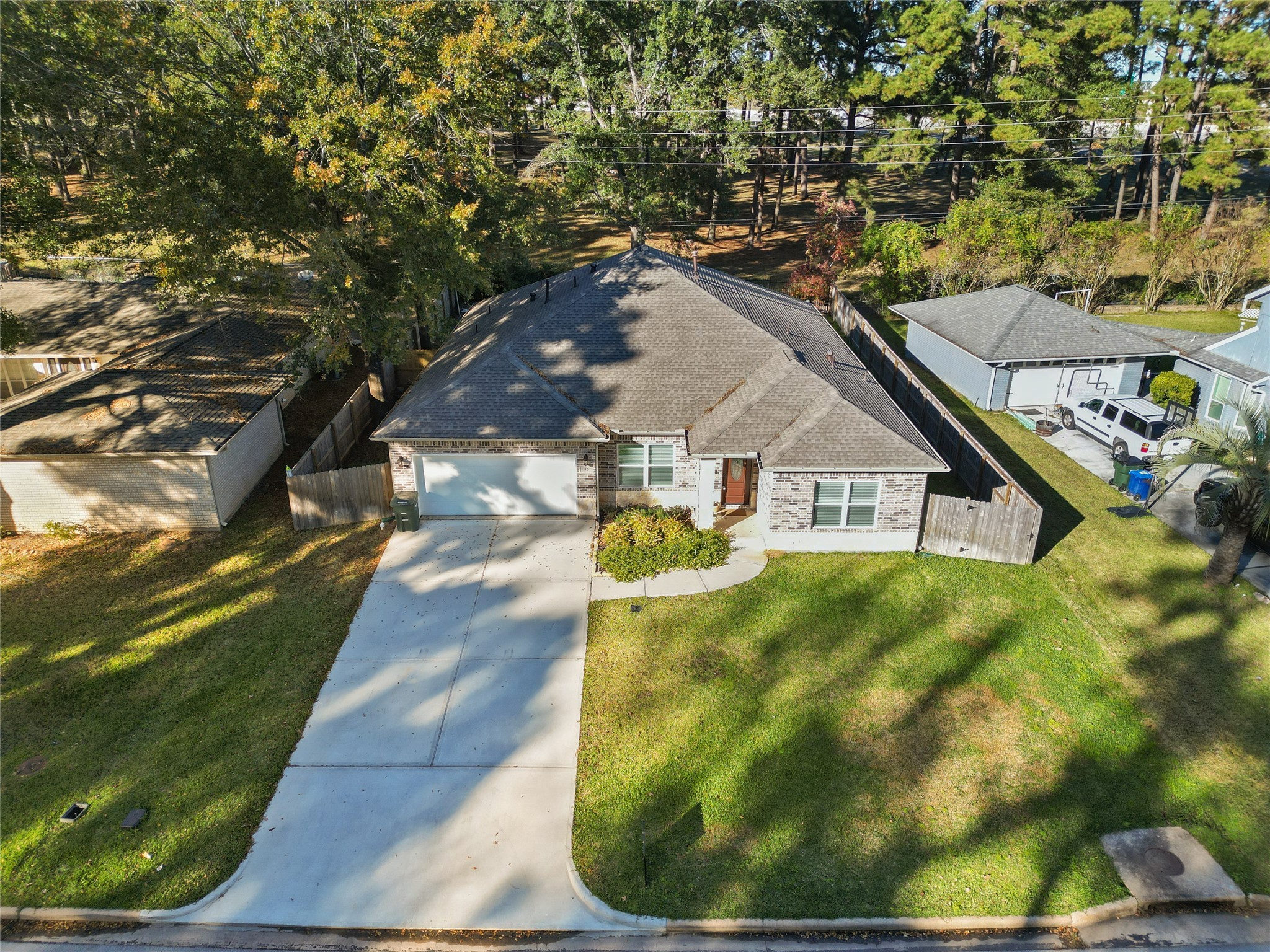 116 Augusta Drive Huntsville, TX 77340 - Photo 2 of 30 a view of a house with a yard