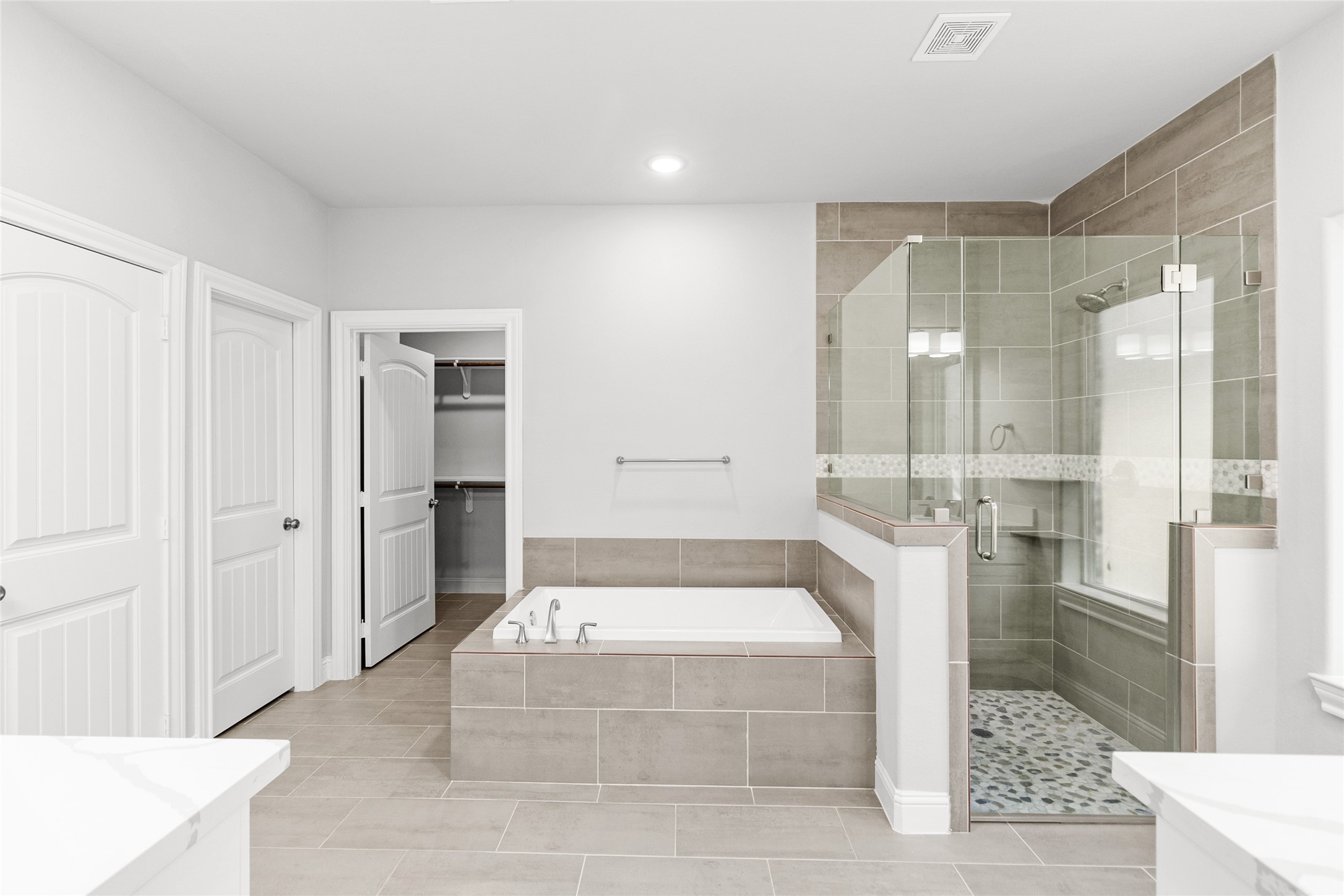 116 Augusta Drive Huntsville, TX 77340 - Photo 21 of 30 a spacious bathroom with a tub shower and mirror