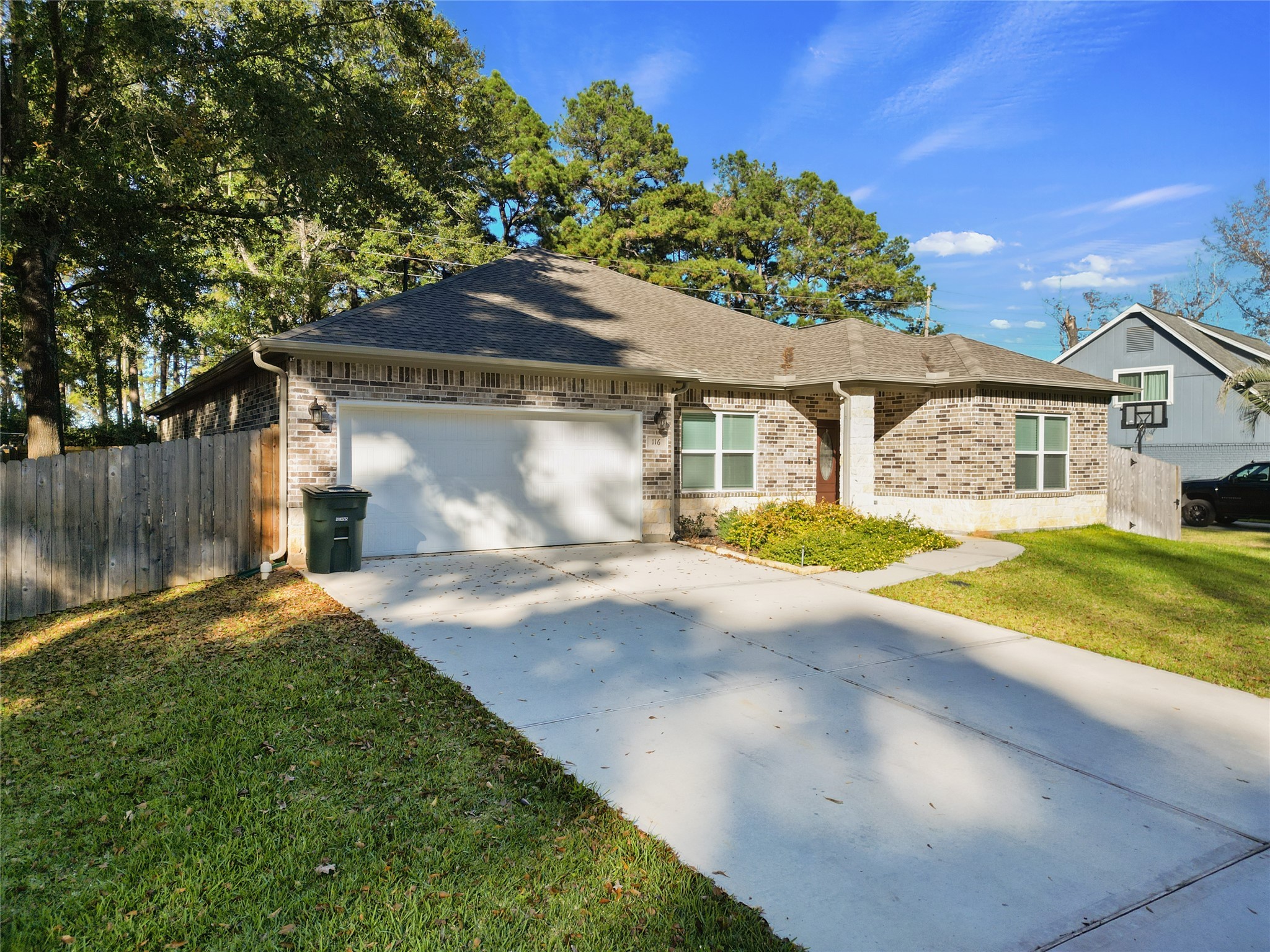 116 Augusta Drive Huntsville, TX 77340 - Photo 4 of 30 a front view of a house with a yard and garage