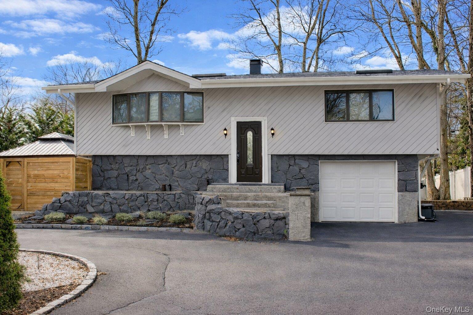 a front view of a house with a garage