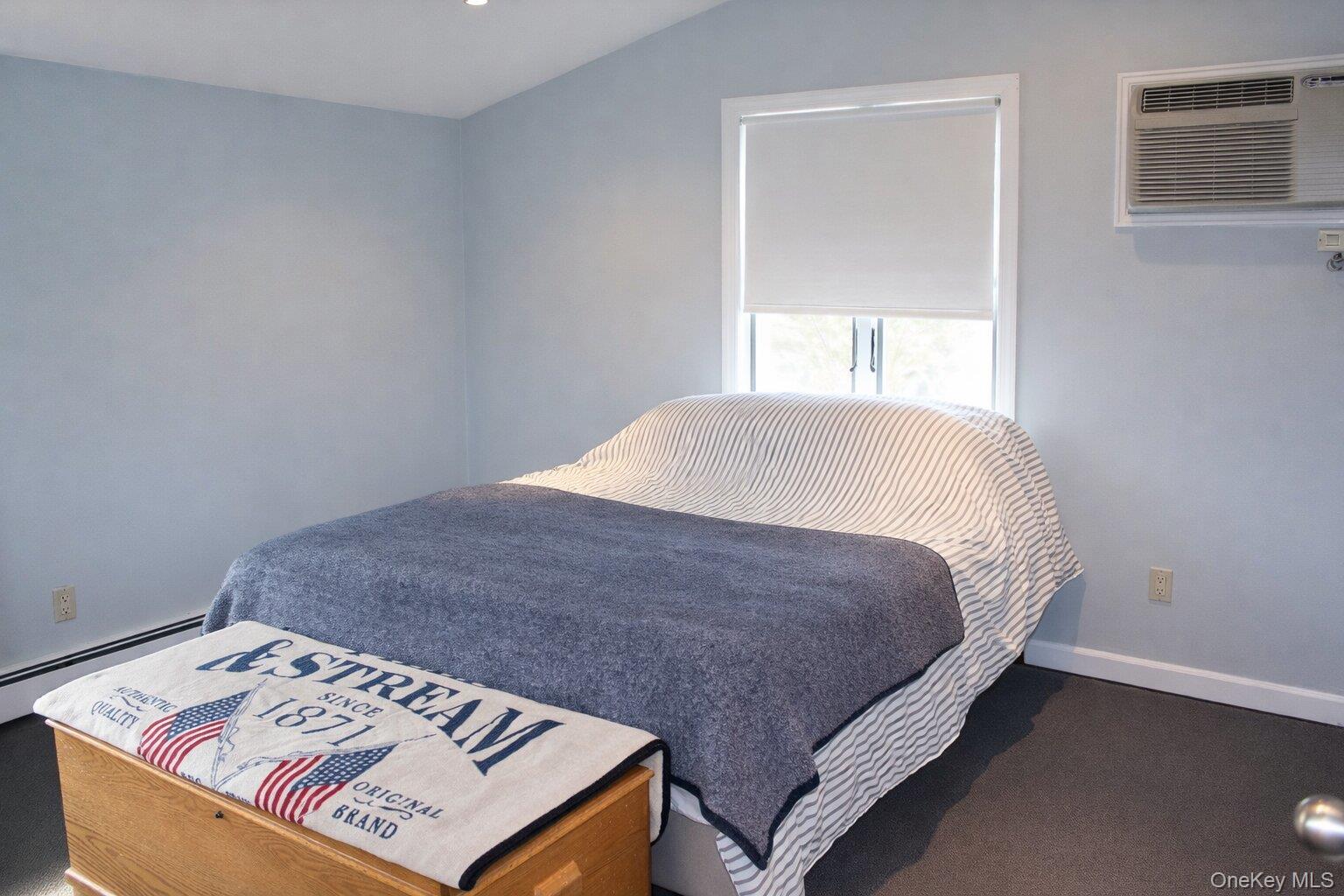 42 Shinbone Lane Commack, NY 11725 - Photo 13 of 23 a bedroom with a bed and a window