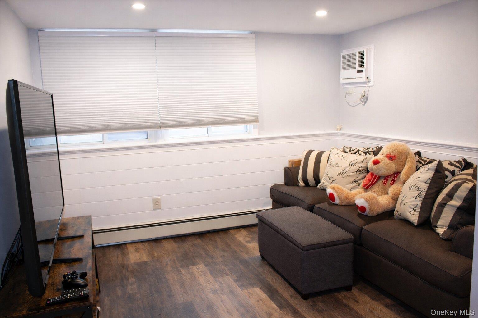 42 Shinbone Lane Commack, NY 11725 - Photo 17 of 23 a living room with furniture and a couch