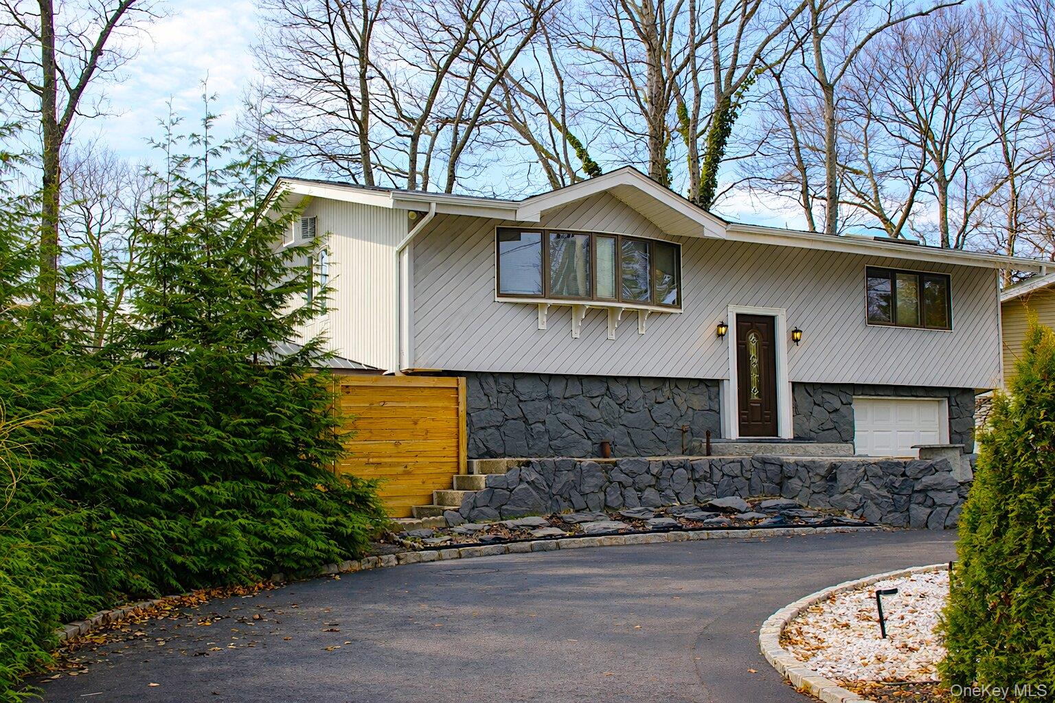 42 Shinbone Lane Commack, NY 11725 - Photo 2 of 23 a front view of a house with a yard