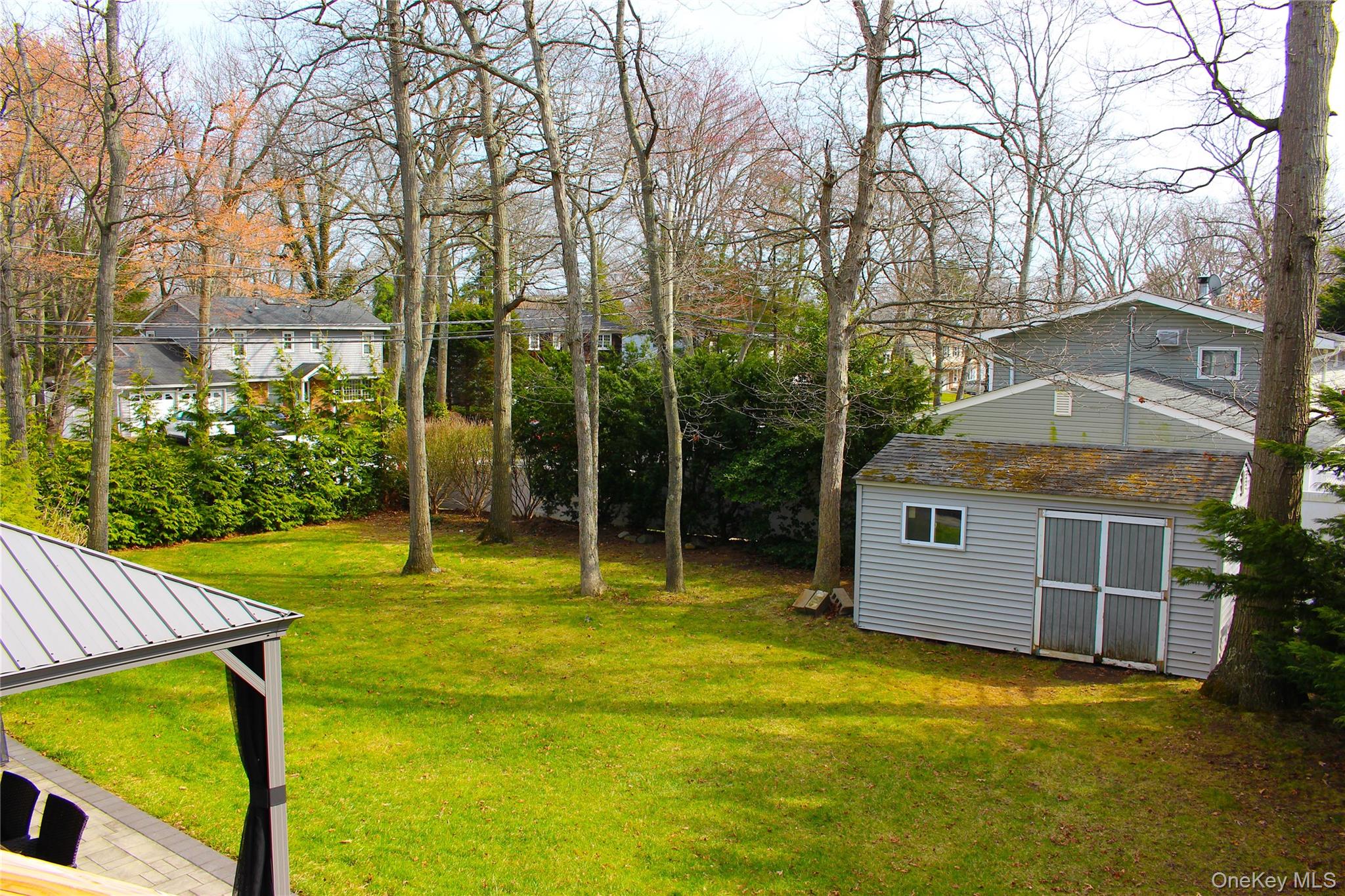 42 Shinbone Lane Commack, NY 11725 - Photo 21 of 23 a view of a house with backyard and sitting area