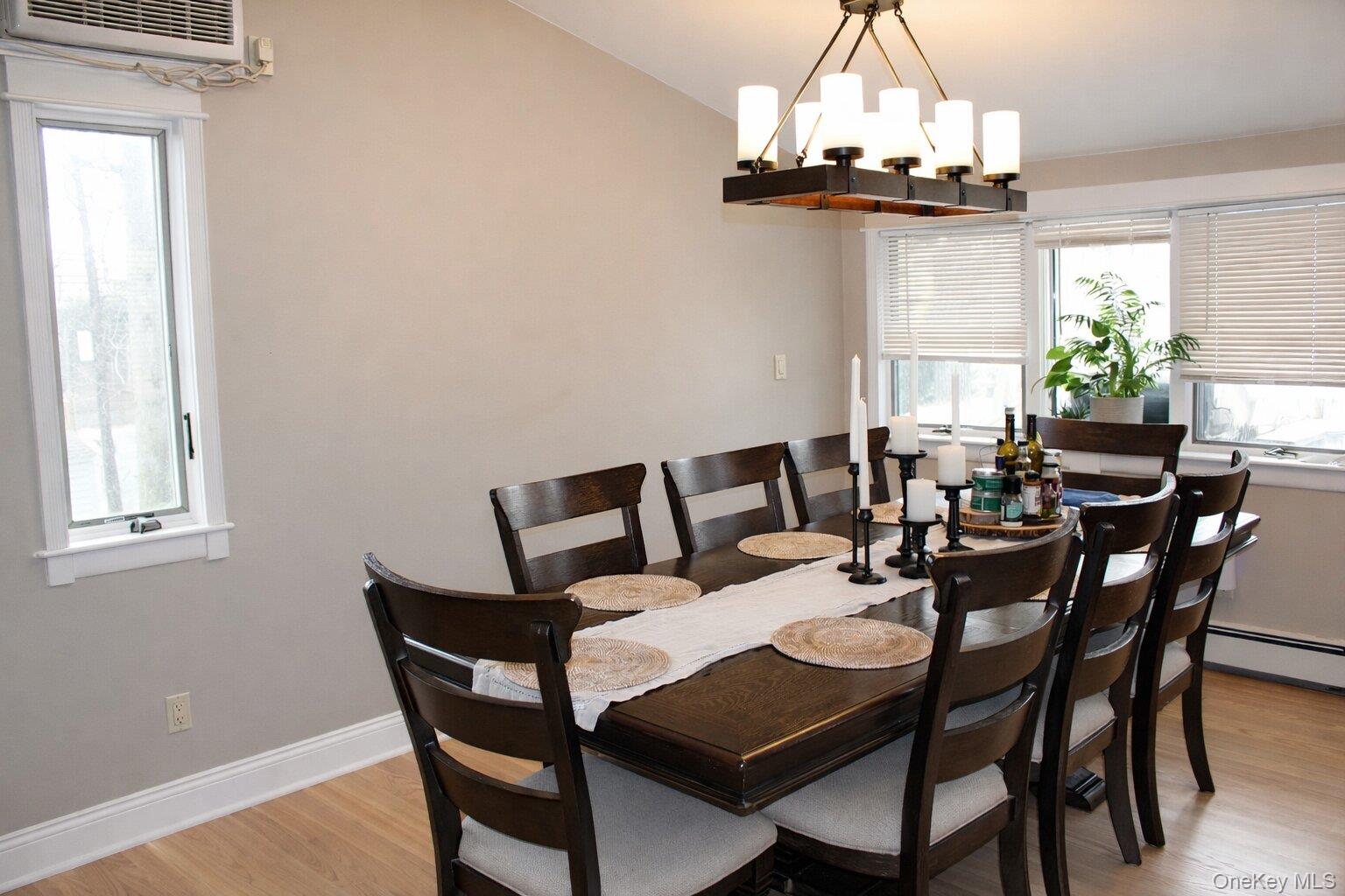 42 Shinbone Lane Commack, NY 11725 - Photo 6 of 23 a view of a dining room with furniture and a chandelier