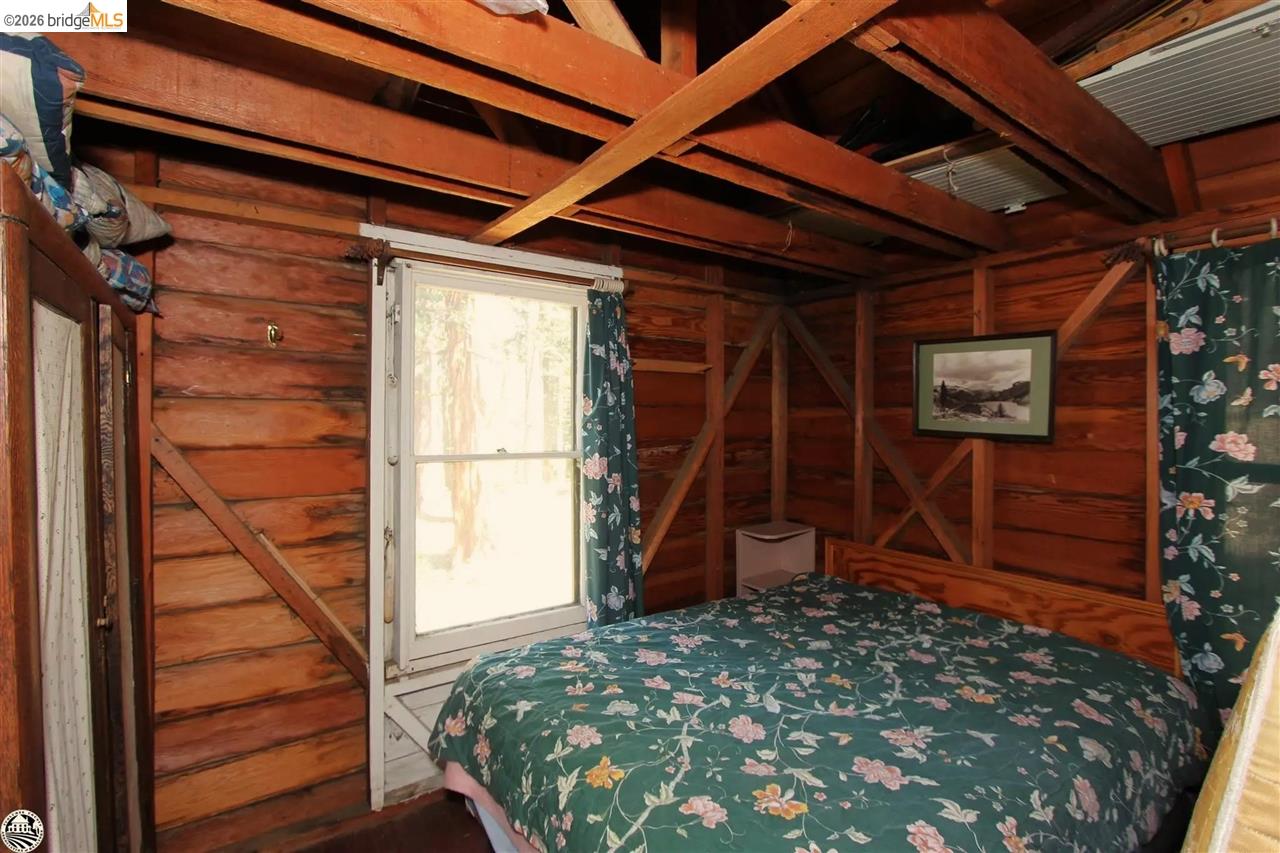 7 Riverside Tract Kyburz, CA 95720 - Photo 16 of 25 a view of a room with wooden floor and a ceiling fan