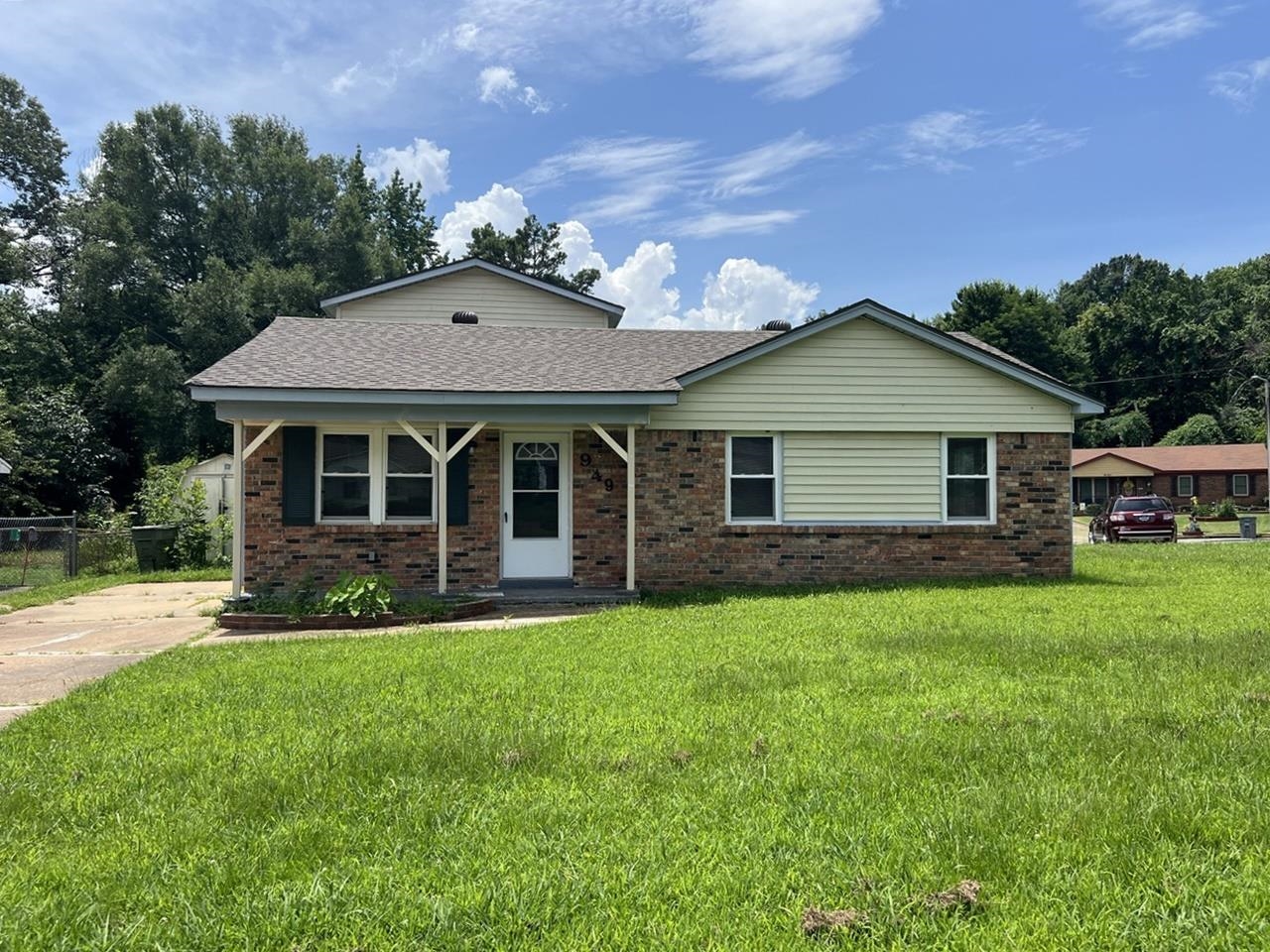 a front view of a house with a garden