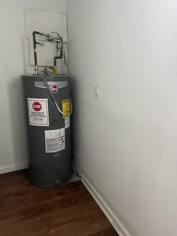 a bathroom with a black and white checkered floor