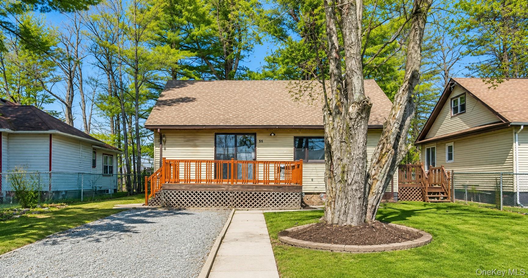 55 Hasbrouck A Road Fallsburg, NY 12759 - Photo 1 of 8 a front view of a house with a yard