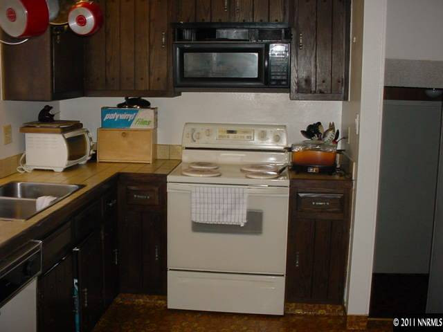 1565 Boyer Court Reno, NV 89503 - Photo 4 of 8 a kitchen with a stove and a microwave