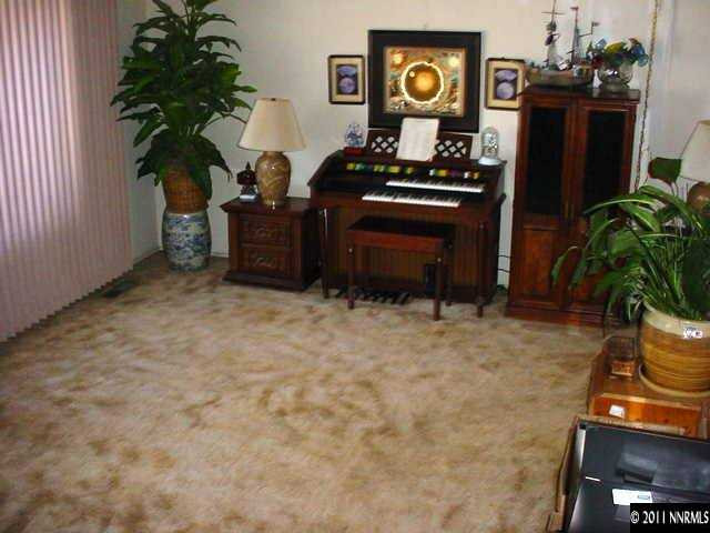 1565 Boyer Court Reno, NV 89503 - Photo 8 of 8 a living room with furniture and a potted plant