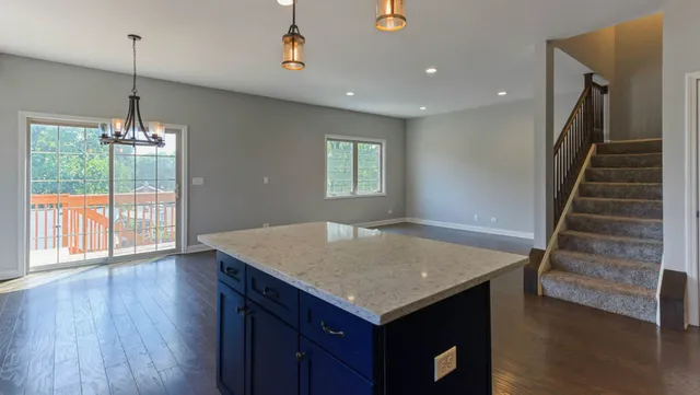 a kitchen with a table and chairs