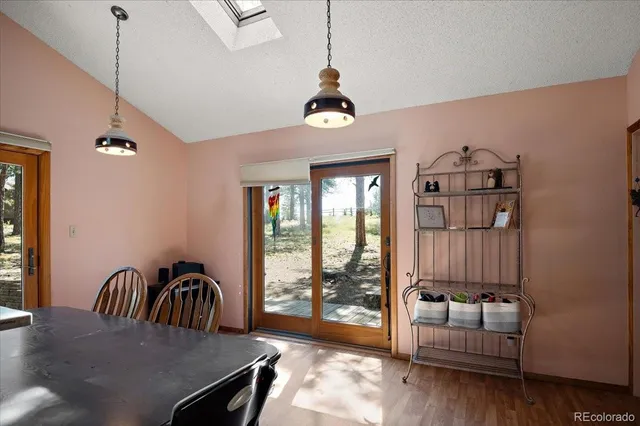 a view of a livingroom with furniture window and wooden floor