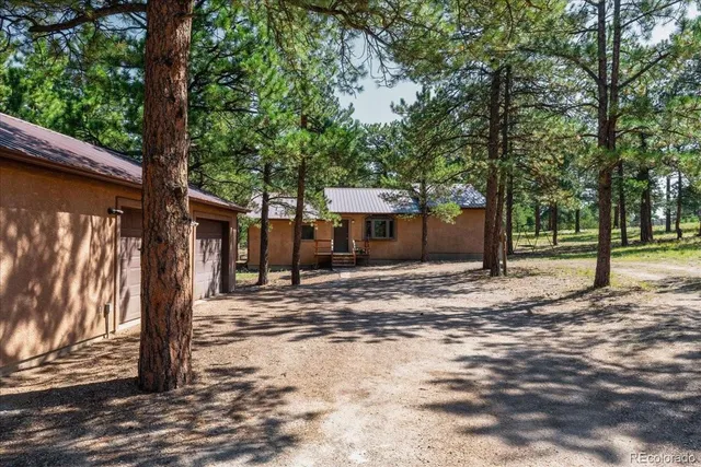 a front view of a house with a tree shower