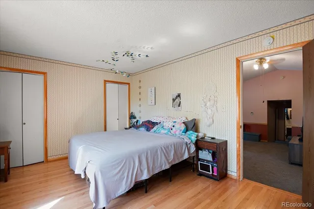 a bedroom with a bed and a table in it