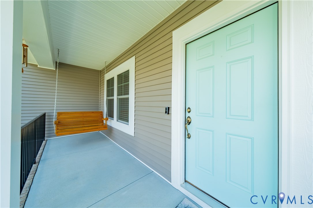 15607 Crowden Road Chesterfield, VA 23832 - Photo 7 of 57 Front porch with siding exterior, light blue panel