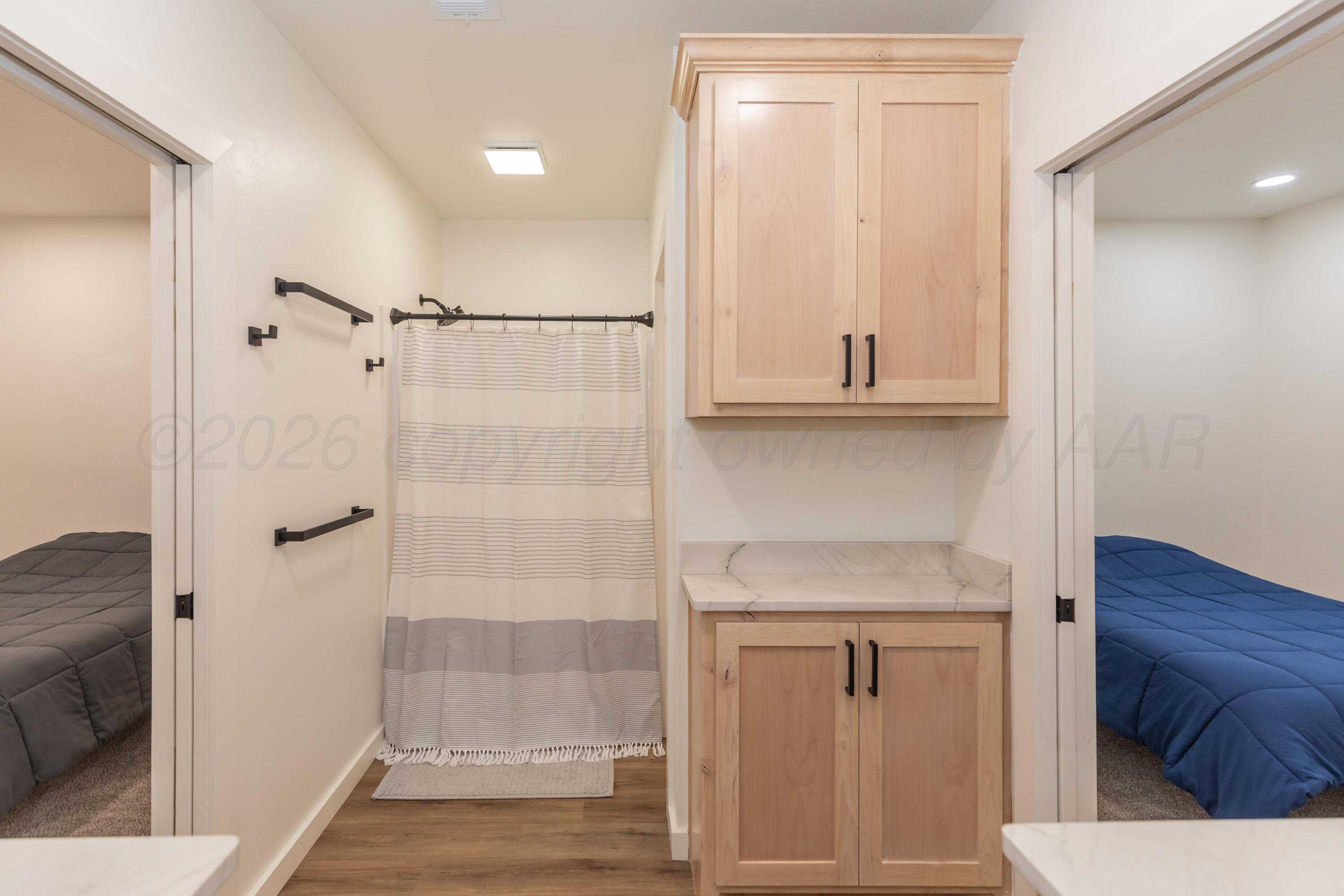 504 High Street Claude, TX 79019 - Photo 8 of 39 a bathroom with a shower