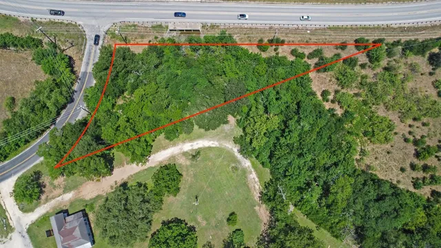 a view of a garden with a building