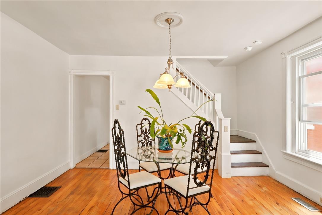 803 Spring Street Bethlehem, PA 18018 - Photo 7 of 34 A classic chandelier illuminates the polished wood floors of this charming dining space.